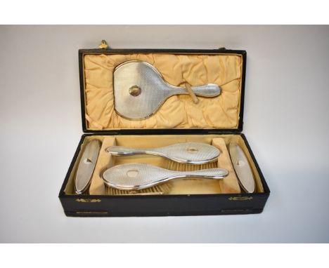 Hasset &amp; Harper Ltd a silver six piece dressing table set with engine turned detail, vacant cartouche, Birmingham 1923, i