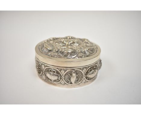 A white metal lidded trinket box, all-over repousse design of insects and creatures, 4cm tall x  8.7cm long, 91g