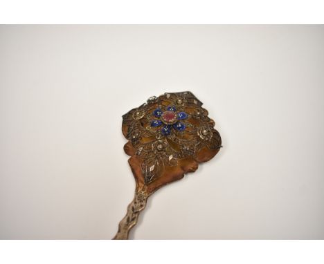 A 19th Century silver bodice pin with filigree decoration enamel and stone centre of floral form