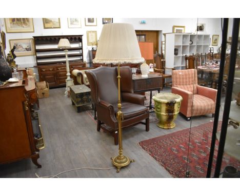 A heavy brass height adjustable tri-bulb standard lamp with ornate base and lion paw feet (shade included)