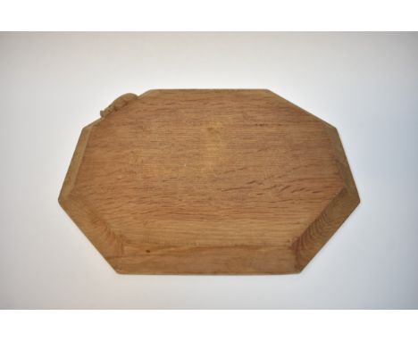 A Robert Thompson (Mouseman) oak cheeseboard with carved mouse detail to surface 25cm x 30.5cm