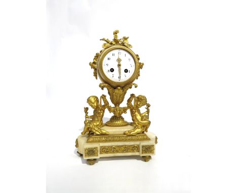 A 19th Century French ormolu/gilt metal and marble mantel clock, the floral decorated clock drum held by acanthus form urn an