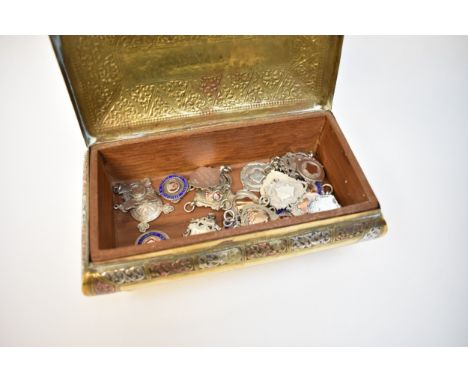 A box containing silver Alberts to include enamel and gold inlaid examples in Eastern brass casket (22)