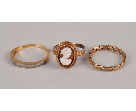 A group of three vintage gold rings, one being an 18ct gold half hoop, 2.9g, one a 9ct gold full eternity, the other a 9ct go