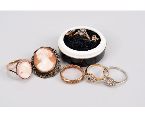 A small group of jewellery, including an Art Deco ring set with clear stones, a 9ct gold and sapphire ring and earrings, an e