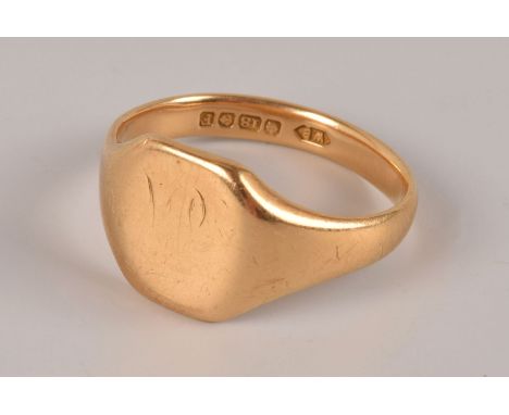 An 18ct gold signet ring, the squared tablet once engraved, hallmarked, approx 6.3g and size S