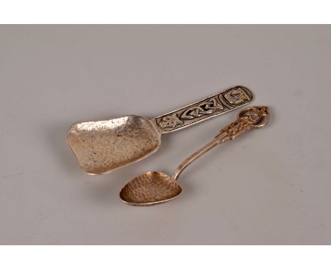 A sterling silver Scottish caddy spoon, plus an ornate continental Art Nouveau coffee spoon (2)