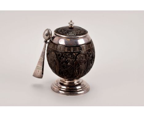 A 19th century silver mounted coconut sucrier, with scrolling acanthus decorated lid surmounting a silver mounted, and pierce