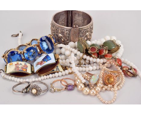 A collection of jewellery, including a yellow metal and citrine style ring with seed pearls, an opal ring, an amethyst ring, 