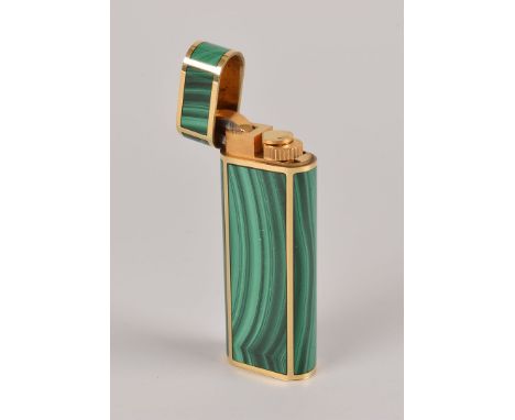 A fine 18ct gold and malachite cigarette lighter from Cartier, the oval elongated form having inset green hardstone panels, a