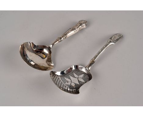 A George III silver caddy spoon by John Thornton, Birmingham 1811, with brightcut decoration, plus a Regency example by the s