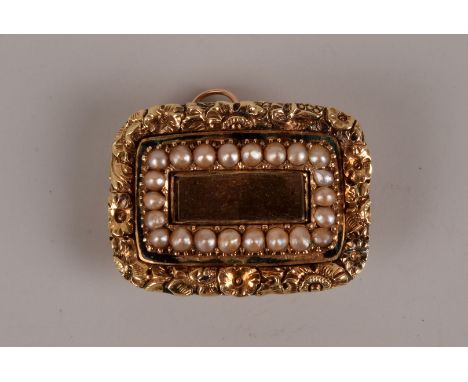 A late George III period gold mourning brooch cum pendant, the ornate oblong mount having chased floral border enclosing a ro