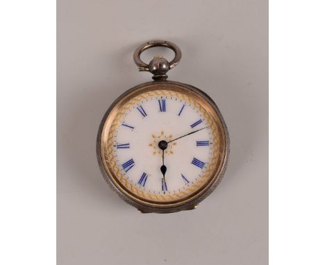 A late 19th century continental silver lady’s open faced pocket watch, white enamel dial with blue Roman numerals and gilt ed