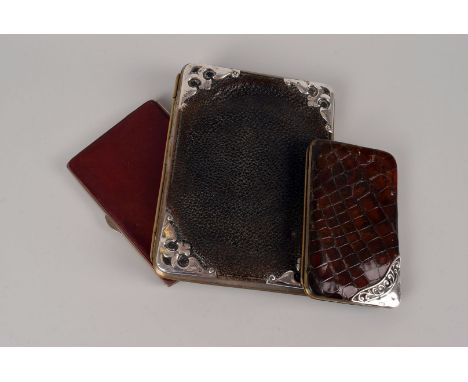 A silver mounted hide wallet by Danziger &amp; Isaacs, import marks for Birmingham 1903, plus a crocodile skin purse with sil