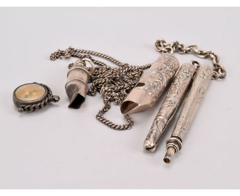 A collection of silver novelty fob chain attachments, including a matching retractable pencil and penknife with repoussé figu