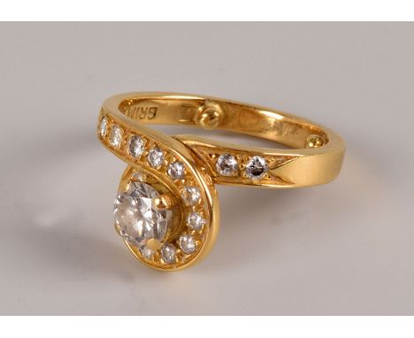 A modern 18ct gold and diamond ring, from Grima, having an approx 0.45ct/0.5ct brilliant cut to centre of looped diamond set 