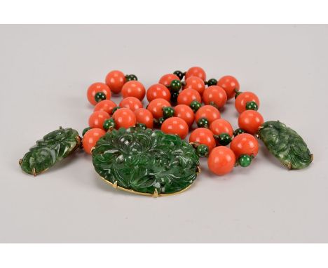 A fine Chinese jade and coral necklace with earrings, the spinach jade carved and pierced panel set in 14ct gold mount having