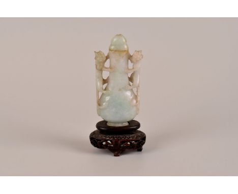 A celadon jade scent bottle, with qilin handles, and domed lid 8.5cm H, presented on carved wooden stand 11cm H AF
Overall fa