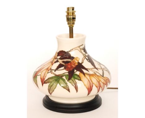 A Moorcroft Pottery Sumac Tree pattern table lamp base designed by Phillip Gibson, the body decorated with tubelined autumnal