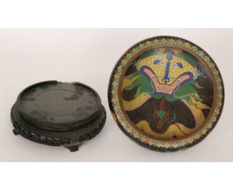A late 19th and early 20th Century Chinese cloisonne famille noir circular bowl, the interior decorated with a yellow and gre