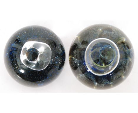 A 20th Century glass Starbase paperweight by Peter Holmes for Caithness with a central abstract air bubble above a speckled b
