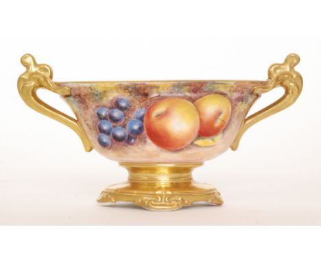 A later 20th Century oval twin handled pedestal bowl decorated by former Royal Worcester artist G. Delaney in the Fallen Frui