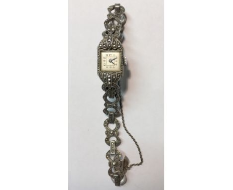 An Art Deco style marcasite cocktail watch, square silvered dial with Arabic numerals, 15 jewel movement to a marcasite set b