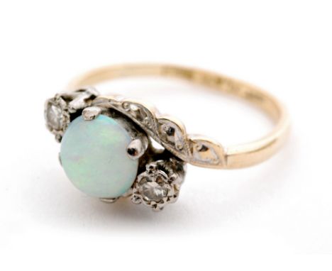 A mid 20th Century 18ct opal and diamond three stone ring, central cabachon opal flanked by diamonds all to a slight twist, r