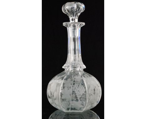 A late 19th Century crystal glass decanter of faceted globe and shaft form below a hollow blown stopper all engraved with fru