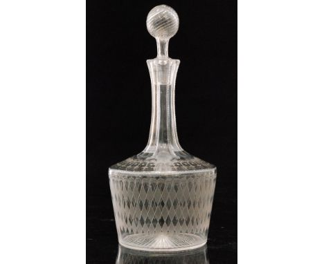 A late 19th to early 20th Century Stourbridge clear crystal glass decanter of shouldered form below a slice cut neck and holl