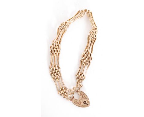 A 9ct rose gold gate link bracelet, seven links with part foliate decoration, terminating in engraved padlock clasp, weight 1