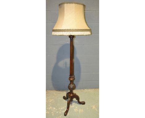 A 19th Century carved mahogany torchere on scroll leaf feet, converted to a standard lamp, height 148cm