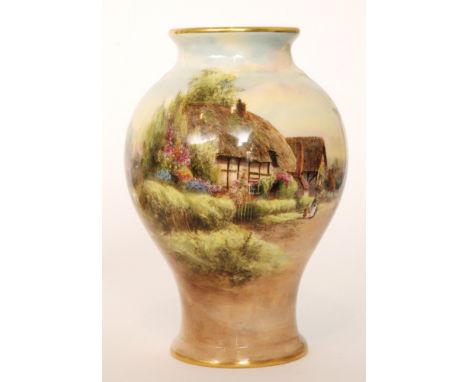 An early 20th Century Royal Worcester inverted baluster form decorated with a transfer applied and hand coloured rural scene 