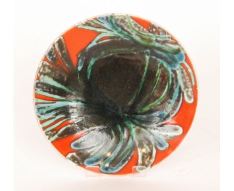 A Poole Pottery shape 3 Delphis shallow footed dish decorated by Jean Millership with a tonal green abstract pattern over a r