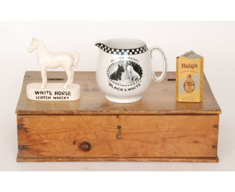 A Shelley black and white pictorial scotch whisky jug, a White Horse scotch whisky model, a miniature Haig's whisky bottle an