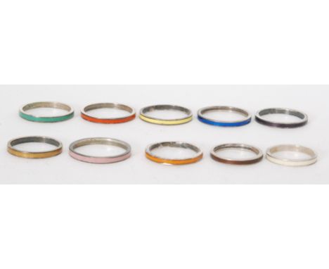 Ten assorted rings each with a different coloured enamel decoration, all from the studio of Bernard Instone, unmarked. (10). 