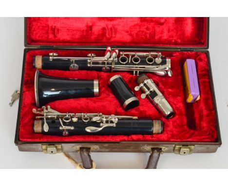 An Evette Clarinet in fitted red plush case.