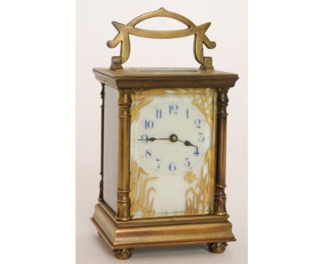 A late 19th to early 20th Century French brass carriage clock with gilded foliate detail to the dial, the movement stamped R 