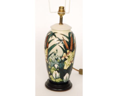 A Moorcroft Pottery table lamp decorated in the Lamia pattern designed Rachel Bishop, affixed to a wooden plinth, height 31cm