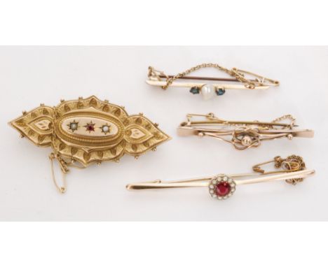 Four Victorian and later 9ct brooches to include a ruby and seed pearl example, a mother of pearl and sapphire bar brooch and