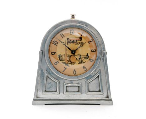 A mid 20th Century General Electric, arch top chrome alarm clock with Arabic numerals and New York World's Fair detail to dia