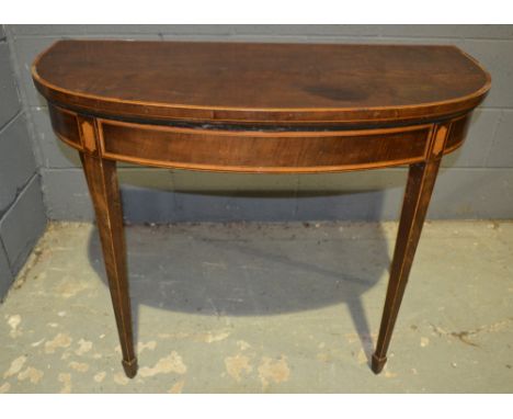 A George IV mahogany crossbanded fold-over card table, raised to square tapered legs, S/D, width 97cm.