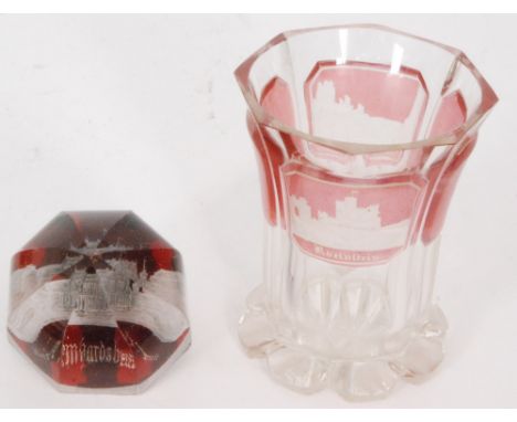 A late 19th to early 20th Century Bohemian glass spa beaker the petal edge foot rising to the flared faceted boy with ruby fl