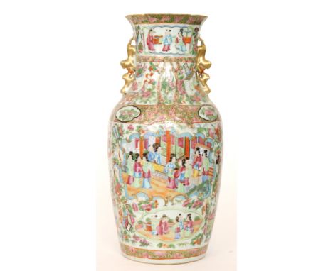 A large Chinese Canton Famille Rose baluster vase decorated with enamel and gilt scenes of women in conversation and children