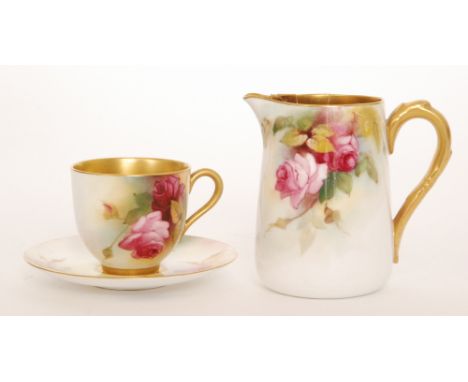 A Royal Worcester cabinet cup and saucer decorated with hand painted roses and foliage, puce mark with date code for 1924, di