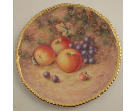 A Royal Worcester cabinet plate, decorated with fruit to a mossy background by H Aryton, with gilt shaped edge, diameter 10in