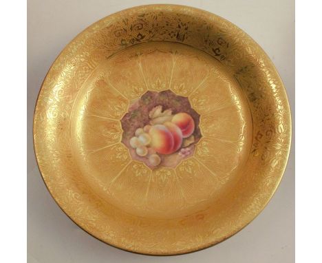 A Royal Worcester dish, decorated with a hand painted fruit centre by Reed, to an acid gilt border, diameter 9.5ins - Good co