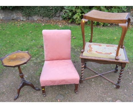 A low upholstered nursing chair, together with a tripod table, a cane topped stool, and an oak stool with tapestry seat and b