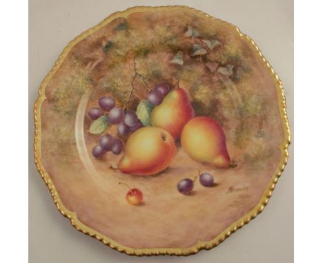 A Royal Worcester cabinet plate, decorated with fruit to a mossy background by Freeman, with shaped gilt edge, diameter 10.75