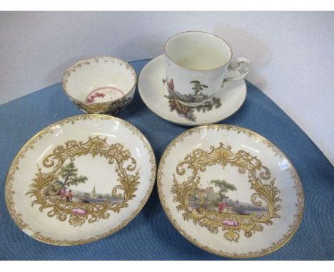 An 18th century coffee can and saucer, decorated in colours with figures in a landscape, together with a continental 18th cen
